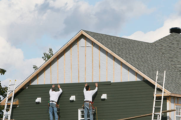 Professional Emergency Siding Repair technician working in Commodore, PA